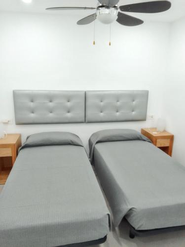 Postel nebo postele na pokoji v ubytování Comfortable Apartment in Arona, 50 m², Shared Pool
