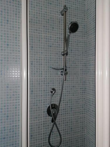 a shower with a shower head in a bathroom at Mavianto in Torre le Nocelle