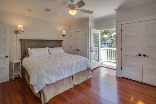 a bedroom with a bed and a ceiling fan at Historic Lady Renovated-Half Mile Walk to DT-Beach 3 Mi-Optional Guesthouse in Saint Augustine