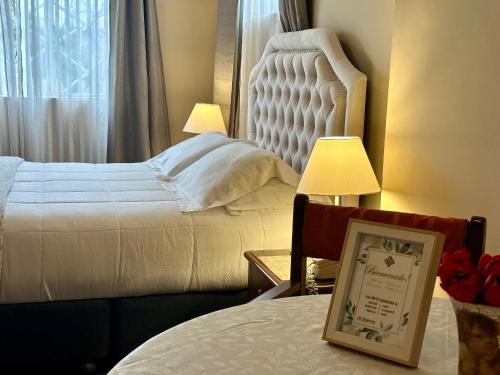 Una cama o camas en una habitación de El Balcon Hostal Turistico