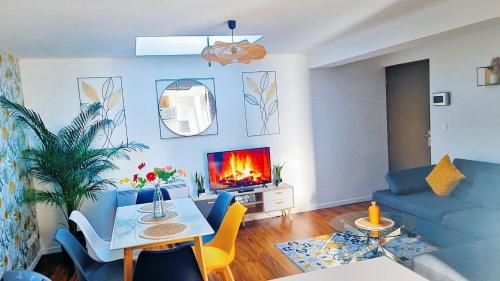 Posezení v ubytování Appartement confortable à Raismes - 60 m², parking privé