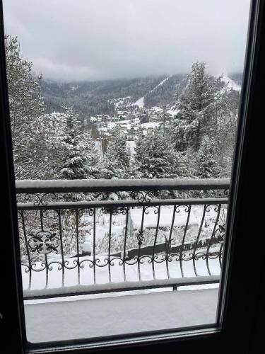 a view from a window of a snow covered mountain at Dom Na Widoku w górach Szczyrk in Szczyrk