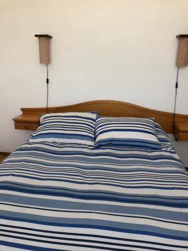 Ένα ή περισσότερα κρεβάτια σε δωμάτιο στο Cabañas Brisas del Mar Los Molles