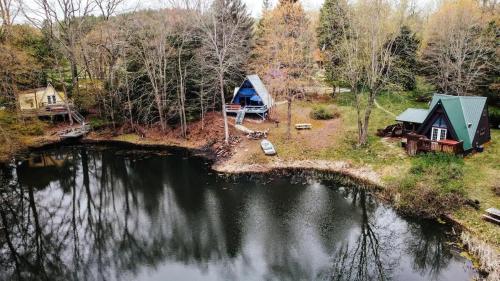 an aerial view of a tent and a lake at Edgewater Escape, Hocking Hills, Hot Tub, Pond in Rockbridge
