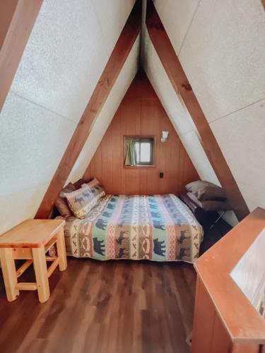 a bedroom with a bed in a attic at Edgewater Escape, Hocking Hills, Hot Tub, Pond in Rockbridge