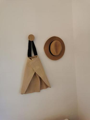 a wall with paper bags and a hat on it at L'Atelier de Maison VB in Le Beausset