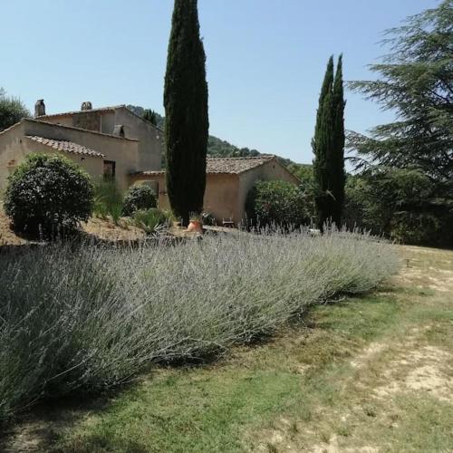 a house with trees and a field of grass at L'Atelier de Maison VB in Le Beausset