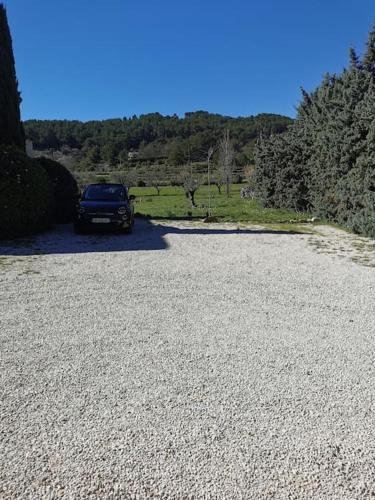 a car parked on the side of a gravel road at L'Atelier de Maison VB in Le Beausset