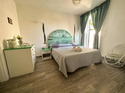 Ένα ή περισσότερα κρεβάτια σε δωμάτιο στο Villa dei Sogni - Aparthotel Ischia Ponte
