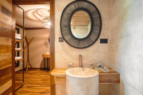 a bathroom with a sink and a mirror at Pearl Mara in Masai Mara