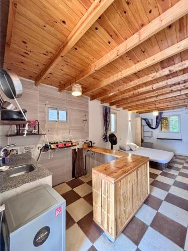 a kitchen with wooden ceilings and a counter top at Mashrum House in Dahab