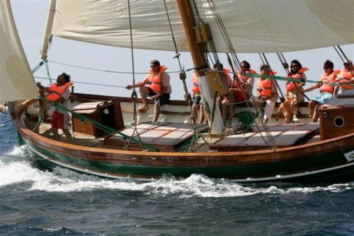 a group of people on a boat in the water at Hotel Villa Pimpina in Carloforte
