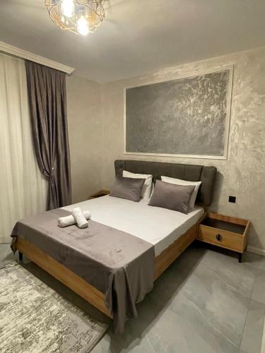 a bedroom with a large bed in a room at Gabala Double Villas in Gabala