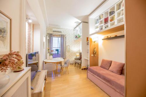 a living room with a couch and a table at Appartamento Sofia in Rome