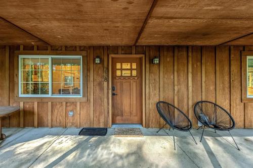 two chairs sitting in front of a house at Alpine Drift in Packwood