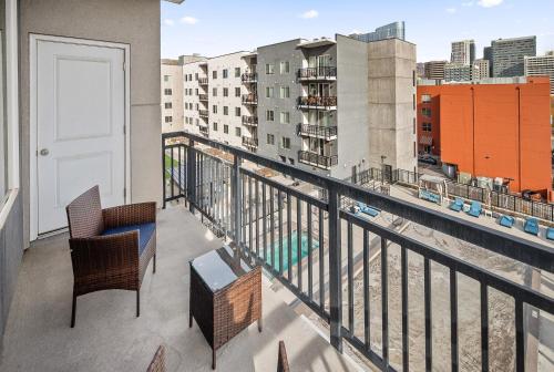 a balcony with a view of a city at Stunning 1BD Pool, Htub, Gym Near Convention Centre in Salt Lake City
