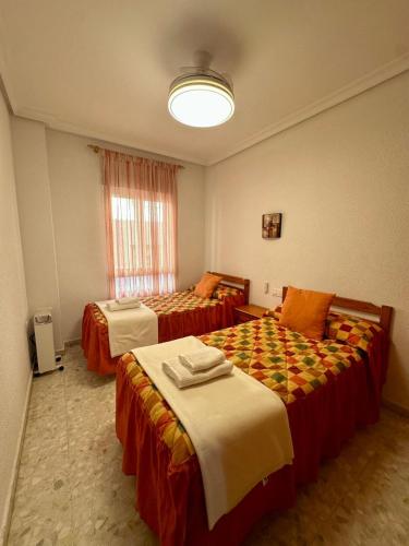 Postel nebo postele na pokoji v ubytování A.T. La Plaza