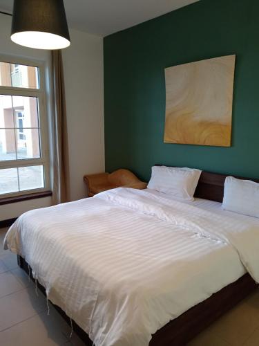 En eller flere senge i et værelse på درة أبراج المارينا Dora Al marina