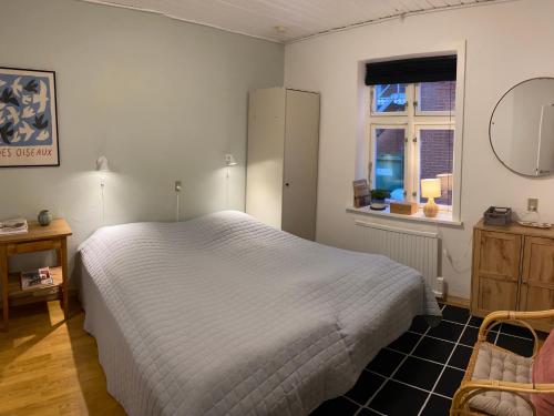 Postel nebo postele na pokoji v ubytování Bredgade 10 Thyborøn