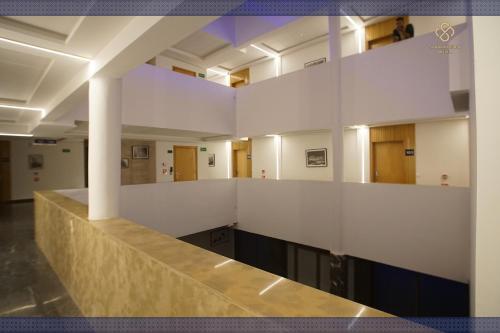 a large room with white walls and a long counter at Sahara Beach in Tan-Tan Plage