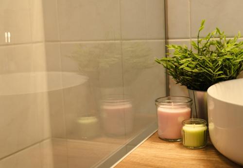 a group of candles sitting on a counter in a bathroom at Central House in Plaka in Athens
