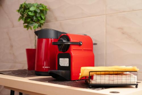 a red toaster sitting on top of a counter at Central House in Plaka in Athens