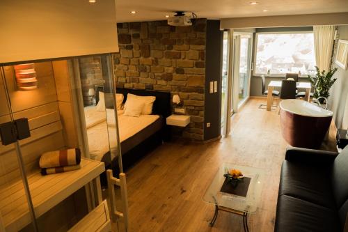 a living room with a bed and a couch at Anitas Ferienhaus in Cochem