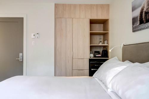 Postel nebo postele na pokoji v ubytování Suites du Lac Moore