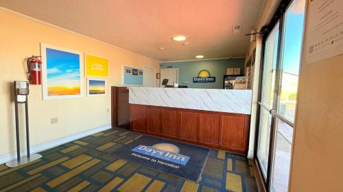 a restaurant with a counter in a room at Days Inn by Wyndham Hannibal in Hannibal