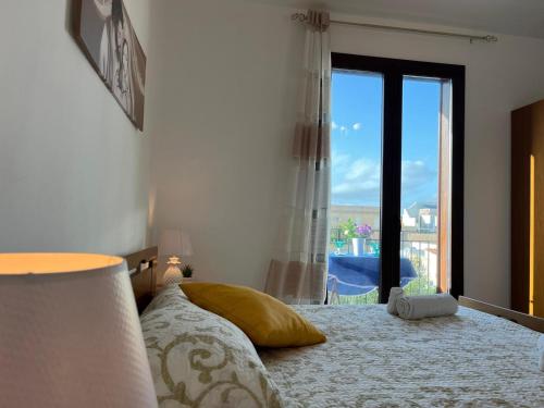 Ένα ή περισσότερα κρεβάτια σε δωμάτιο στο Casa Atena