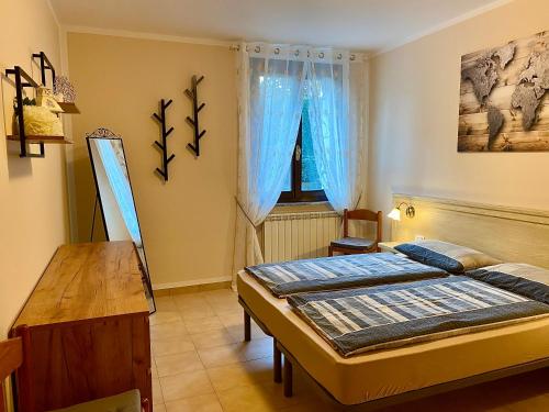 Ένα ή περισσότερα κρεβάτια σε δωμάτιο στο Casa Grazia