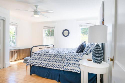 a bedroom with a bed with a blue and white comforter at The Goat Locker in Annapolis