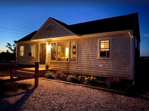 a small house with a bench in front of it at North Truro Pet-friendly home near Secluded Beach in Provincetown