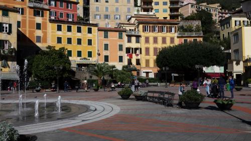a city with a fountain in the middle of a street at DAVANTI AL MARE, FRA PORTOFINO E LE 5 TERRE - IN FRONT Of THE SEA, BETWEEN PORTOFINO AND THE 5 TERRE in Zoagli