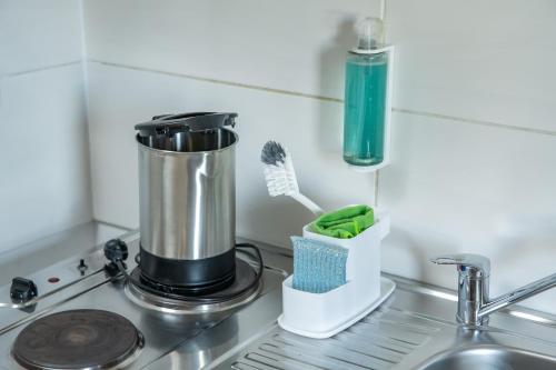 a blender sitting on a kitchen counter next to a sink at Pension Michelangelo in Eisenach