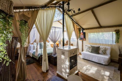 a room with two beds and a fireplace in it at Relais Dei Cesari in Borgo Ticino