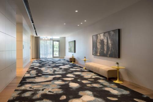 a hallway with a couch and a rug at Residence Inn by Marriott Redwood City San Carlos in San Carlos