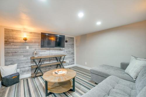 a living room with a couch and a table at The Grand Chelan Group Getaway Pool and Hot Tub in Chelan
