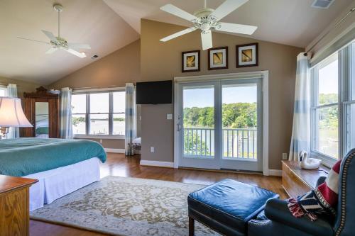 a bedroom with a bed and a balcony at A Shore Thing in Chester