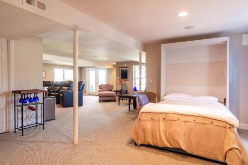 a bedroom with a bed and a living room at A Shore Thing in Chester
