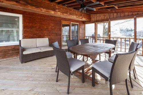 a patio with a table and chairs on a porch at Liberty Call in Arnold