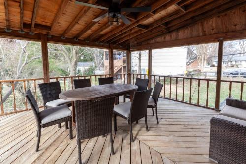 a wooden deck with a table and chairs on it at Liberty Call in Arnold