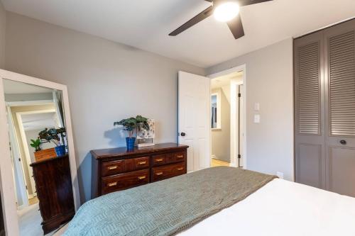 a bedroom with a bed and a dresser and a mirror at Liberty Call in Arnold