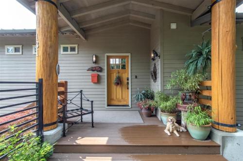 a dog sitting on the porch of a house at Ravenwood in Packwood