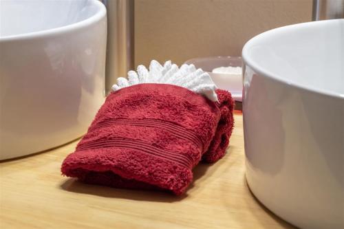 a red sock sitting on a table next to a cup at Ravenwood in Packwood