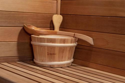 a wooden toilet in a room with a wooden spoon at The Alpenhaus in Packwood
