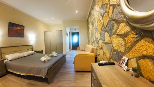 Ένα ή περισσότερα κρεβάτια σε δωμάτιο στο Maria Apartments - Roumanis