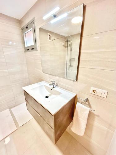 a bathroom with a sink and a mirror at VV Canary Islands 1 in San Miguel de Abona