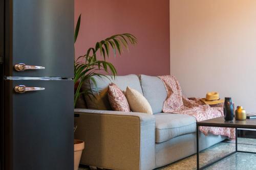 a living room with a couch and a table at MOD 15 City Centre in Agios Nikolaos