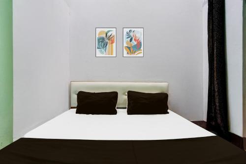 Ένα ή περισσότερα κρεβάτια σε δωμάτιο στο Hotel O Laddu Hotel